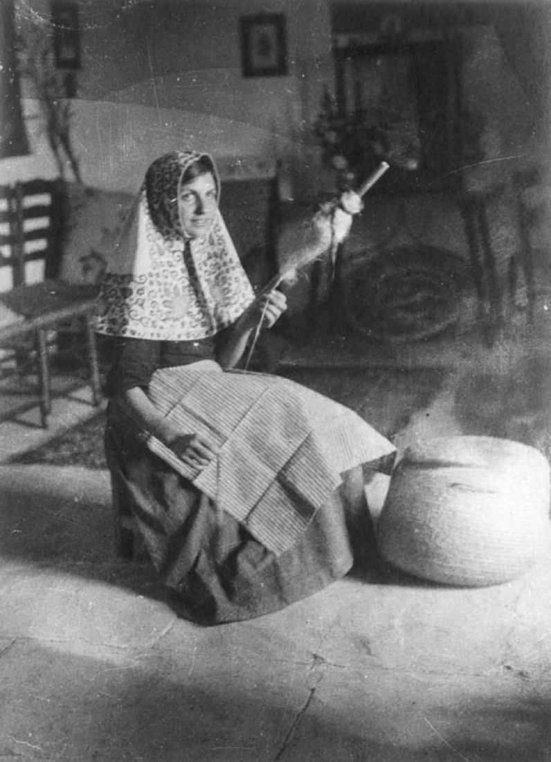 Girl with traditional scarf spinning in Sa Llopassa